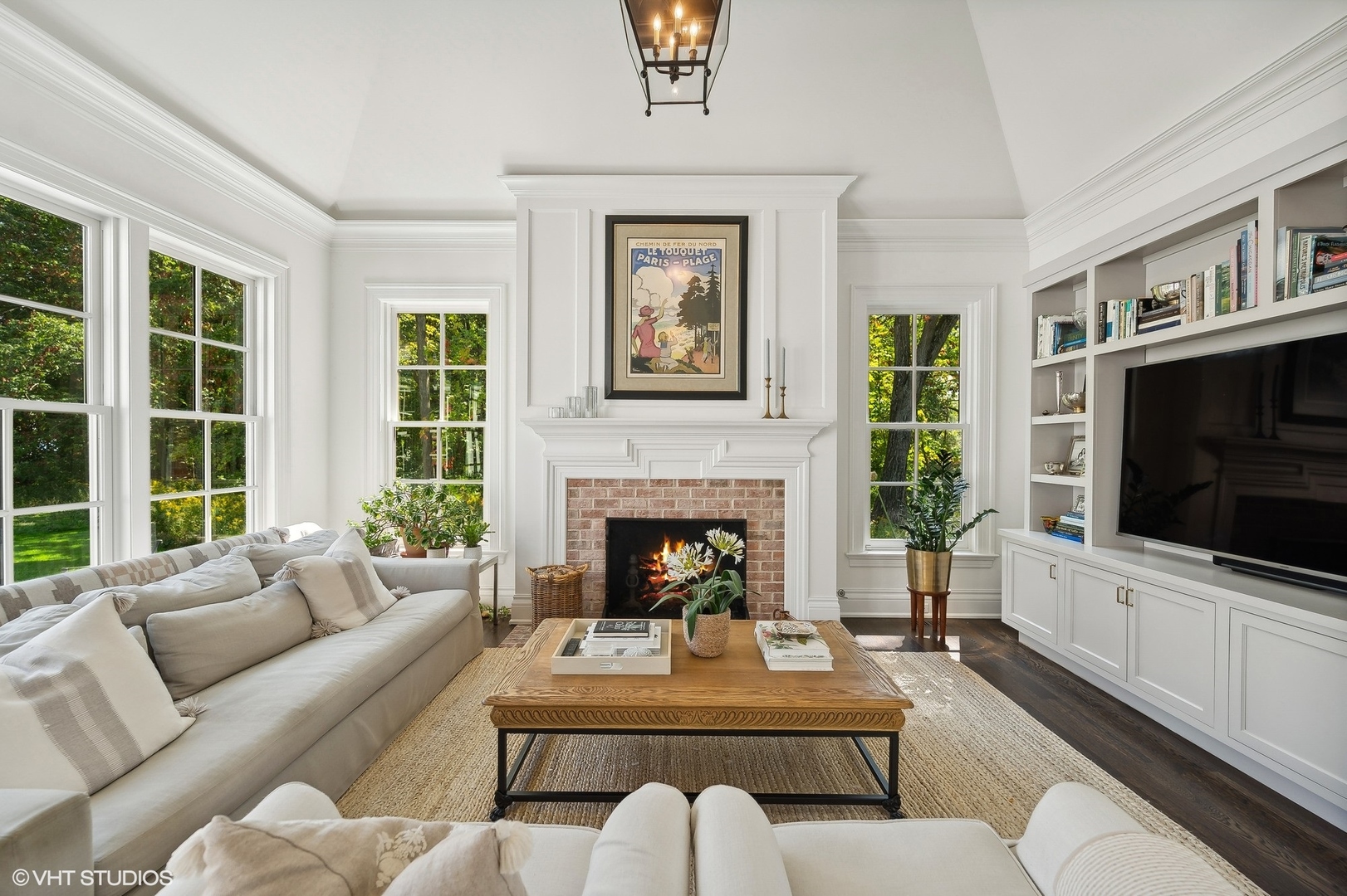 Undisclosed Address Lake Bluff, IL 60044 - Photo 15 of 51 a living room with furniture a fireplace and a flat screen tv