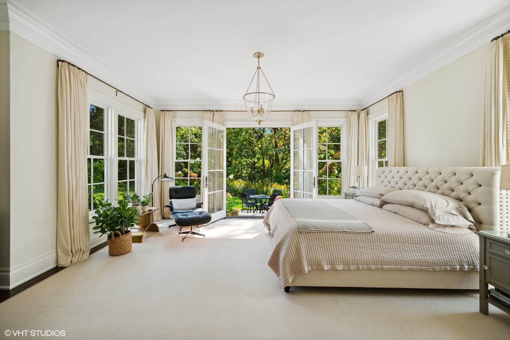 Undisclosed Address Lake Bluff, IL 60044 - Photo 22 of 51 a spacious bedroom with a bed and a large window