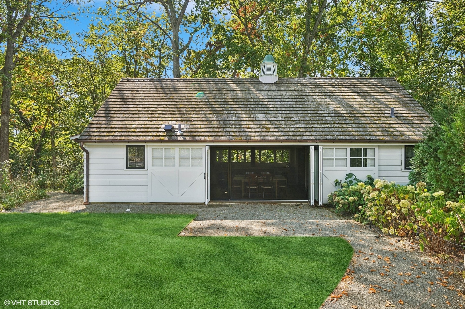 Undisclosed Address Lake Bluff, IL 60044 - Photo 36 of 51 a front view of a house with a garden and yard