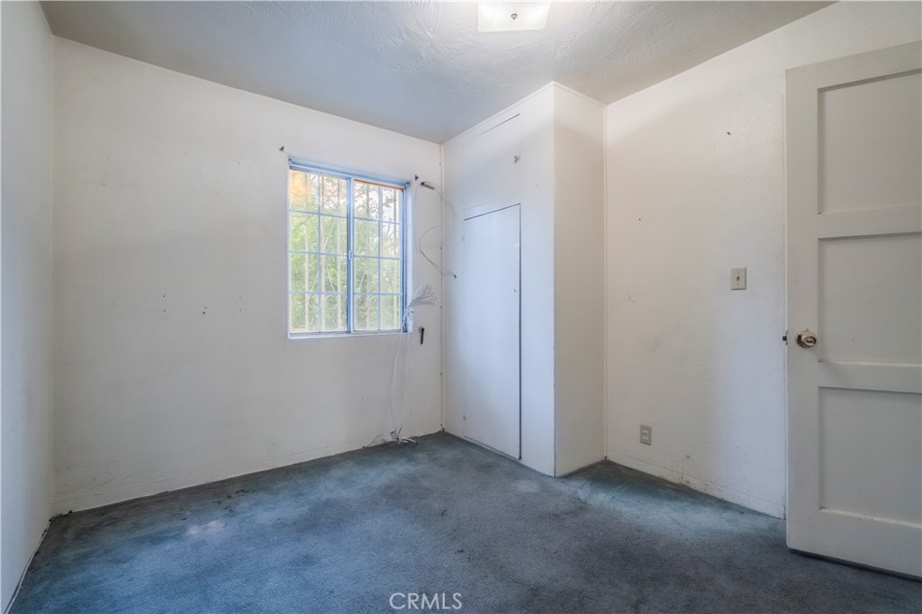 10180 Eddystone Street Riverside, CA 92503 - Photo 13 of 34 a view of an empty room with a window