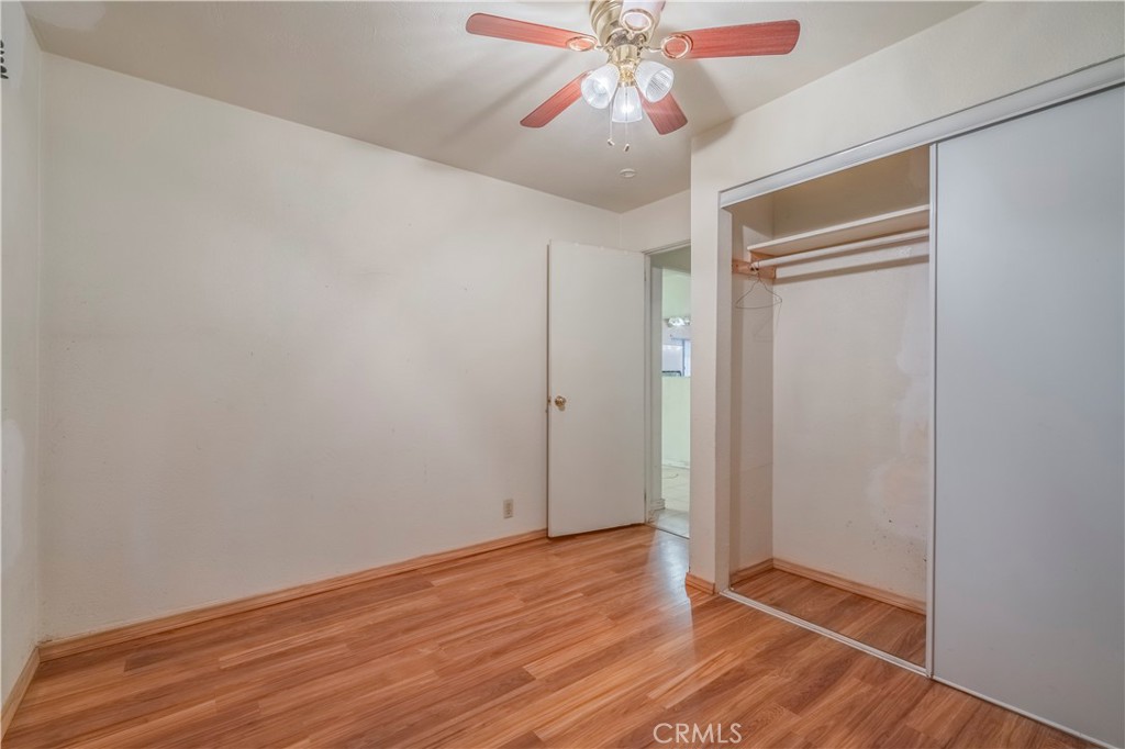 10180 Eddystone Street Riverside, CA 92503 - Photo 15 of 34 a view of an empty room with wooden floor