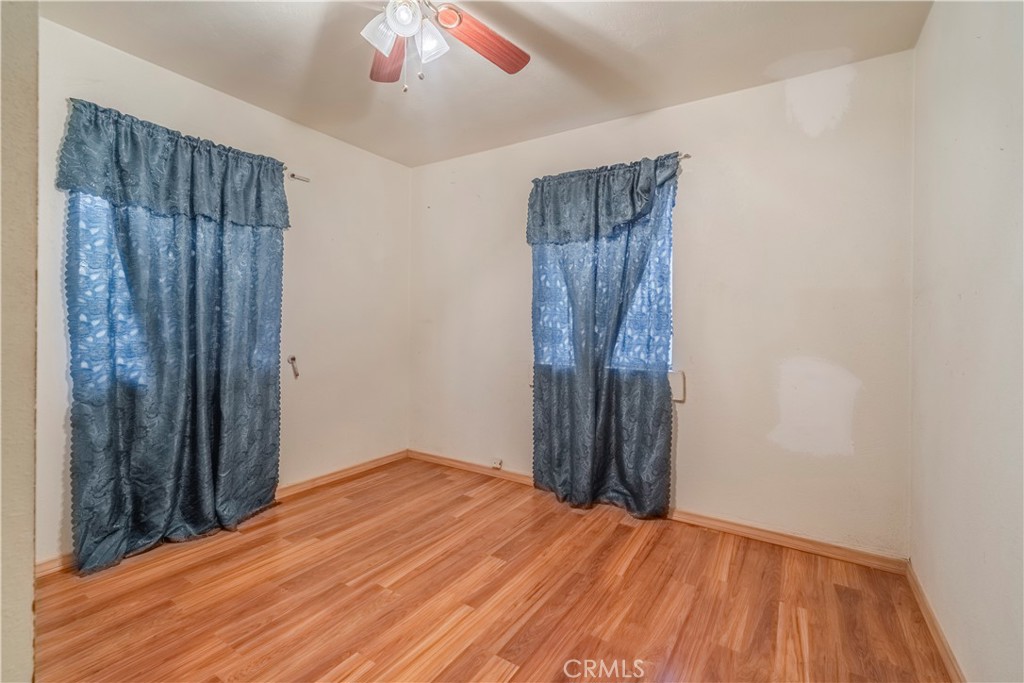 10180 Eddystone Street Riverside, CA 92503 - Photo 19 of 34 a view of a room with wooden floor and closet