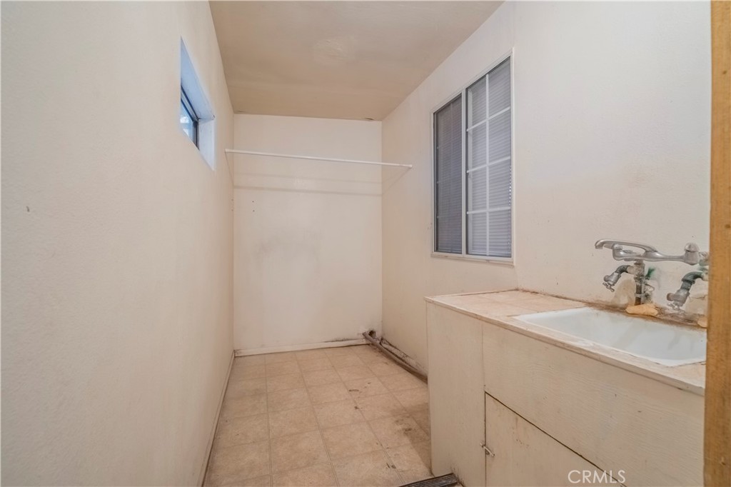 10180 Eddystone Street Riverside, CA 92503 - Photo 20 of 34 a bathroom with a sink and a vanity