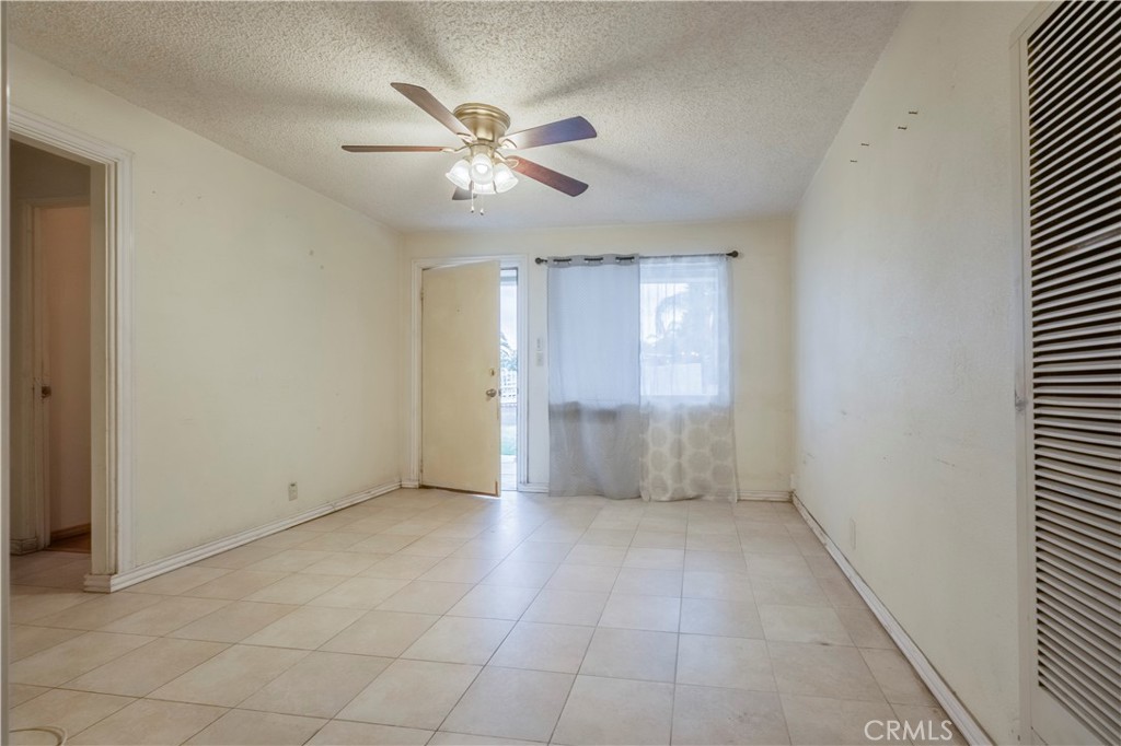 10180 Eddystone Street Riverside, CA 92503 - Photo 28 of 34 en empty room with windows and fan
