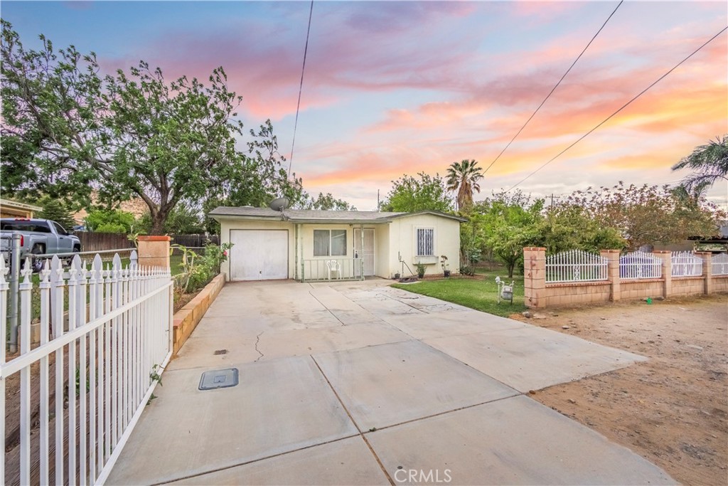 10180 Eddystone Street Riverside, CA 92503 - Photo 8 of 34 a view of a house with backyard and fence