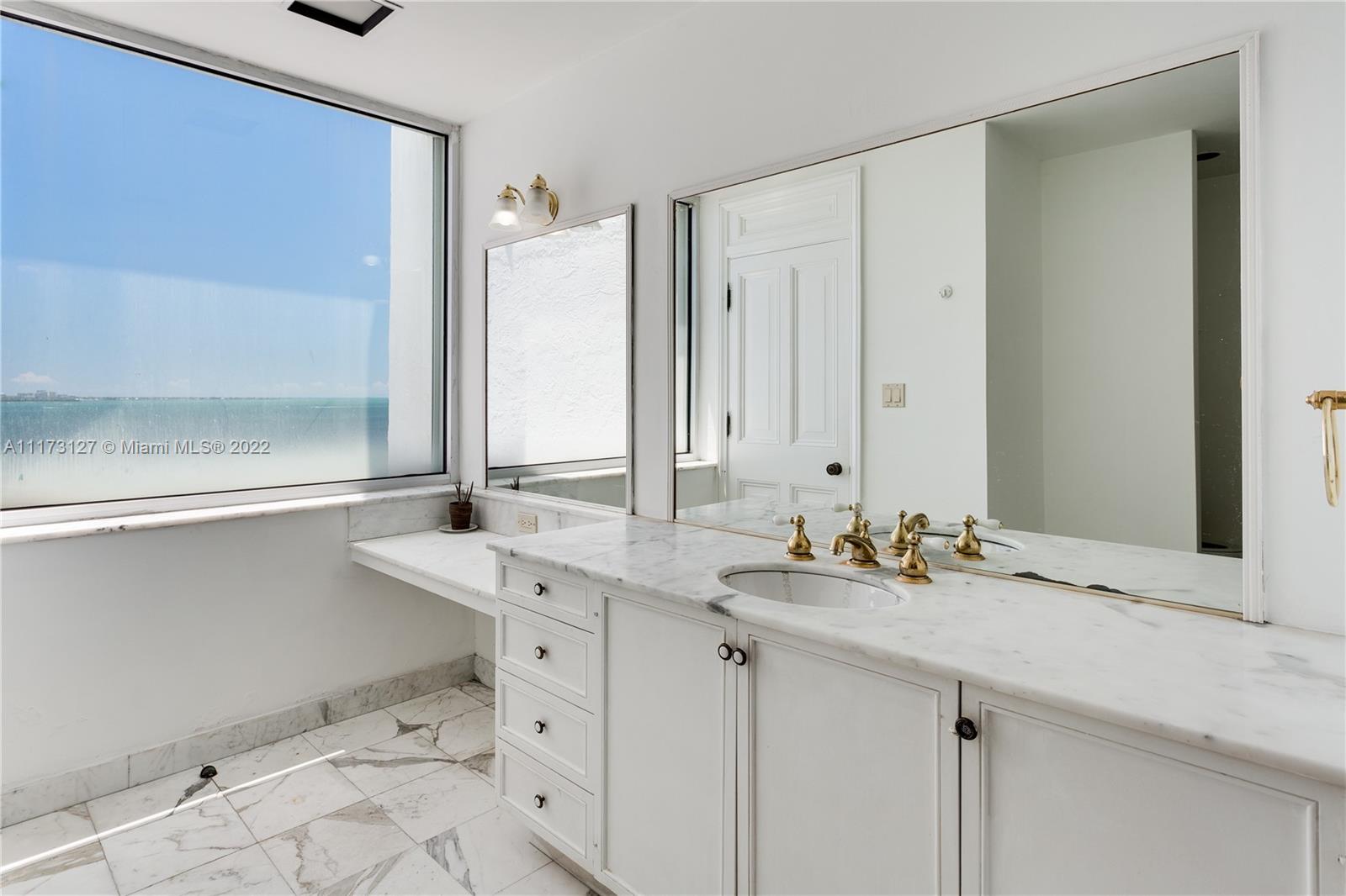 150 Southeast 25th Road, Unit PHA Miami, FL 33129 - Photo 12 of 24 a bathroom with double sink and a mirror