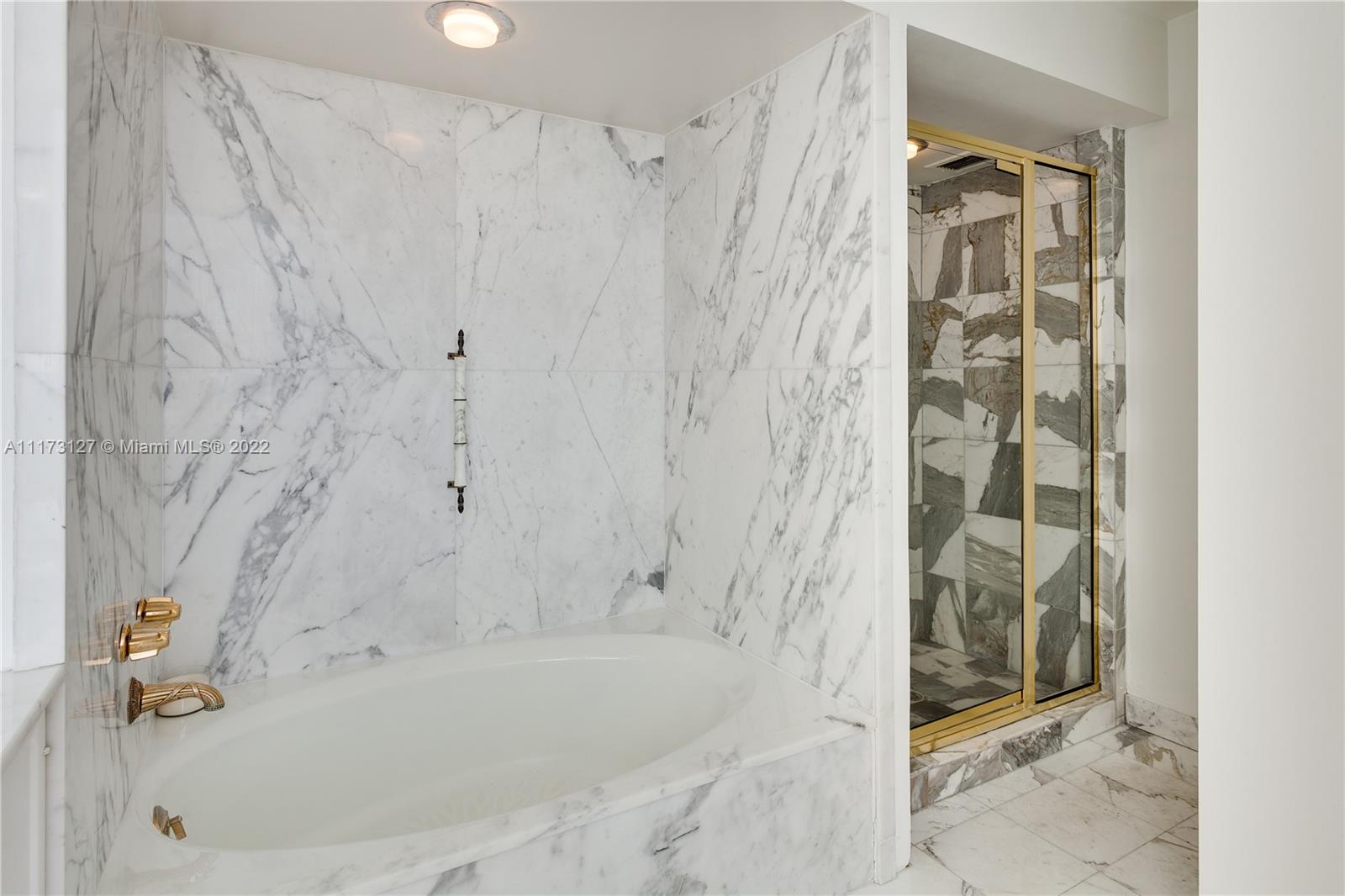 150 Southeast 25th Road, Unit PHA Miami, FL 33129 - Photo 13 of 24 a bathroom with a bathtub