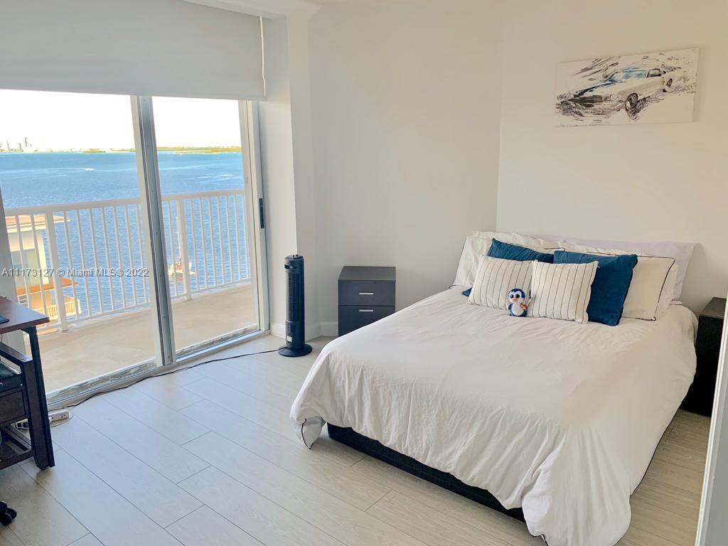 150 Southeast 25th Road, Unit PHA Miami, FL 33129 - Photo 14 of 24 a bedroom with a bed and wooden floor