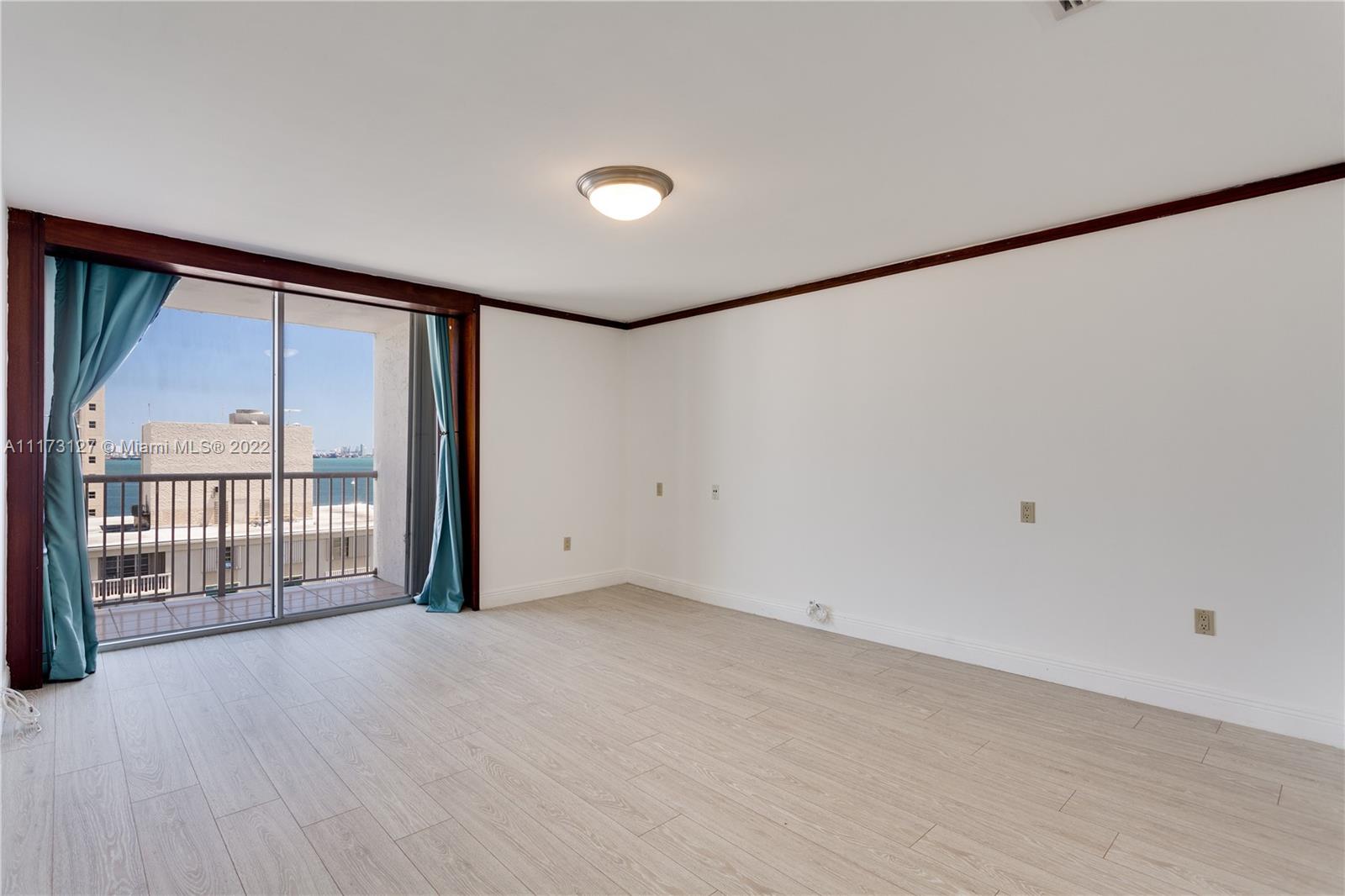 150 Southeast 25th Road, Unit PHA Miami, FL 33129 - Photo 19 of 24 a view of an empty room with a window