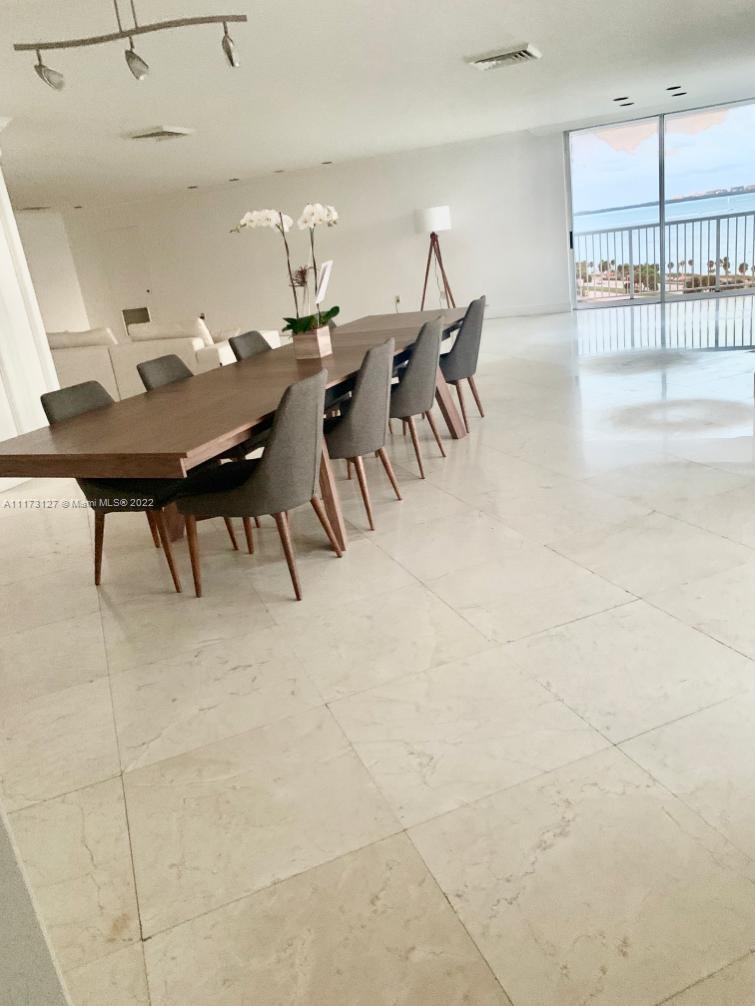 150 Southeast 25th Road, Unit PHA Miami, FL 33129 - Photo 4 of 24 a view of a dining room with furniture