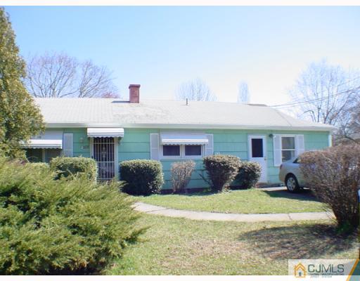 1235 Brookside Road Piscataway, NJ 08854 - Photo 1 of 1 a front view of a house with a yard