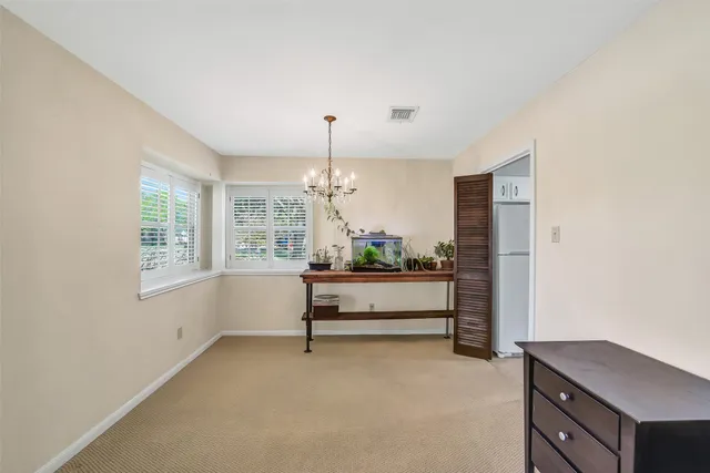 a view of a livingroom with furniture and window
