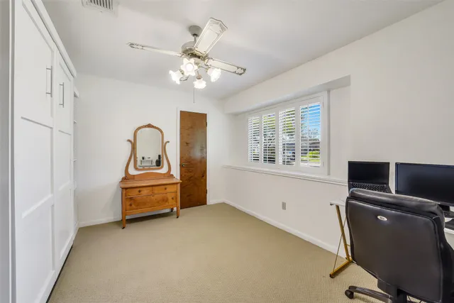 a view of a workspace with furniture