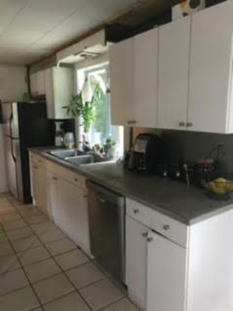 139 Fairview Park Road Sturbridge, MA 01566 - Photo 8 of 15 a kitchen with stainless steel appliances granite countertop a sink a stove and a refrigerator