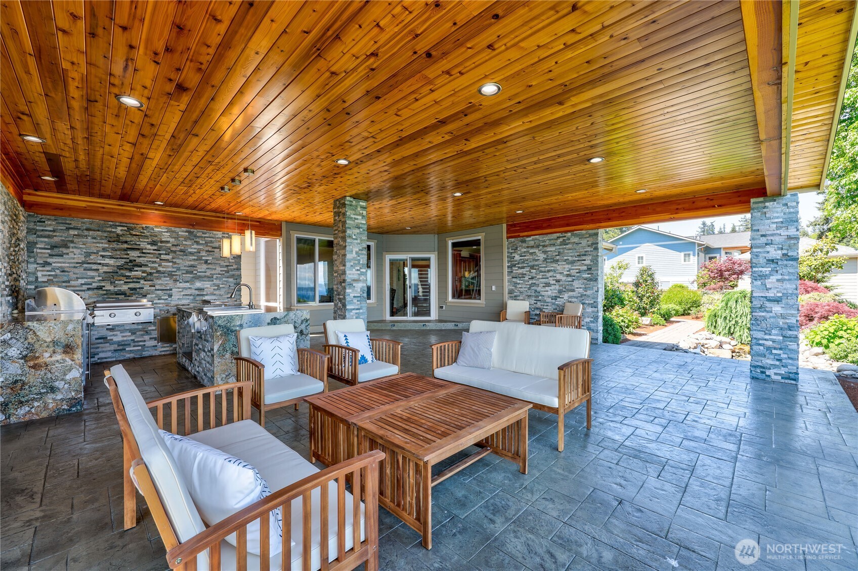 1411 Thorndyke Road Port Ludlow, WA 98365 - Photo 24 of 40 a view of a patio with a table and chairs