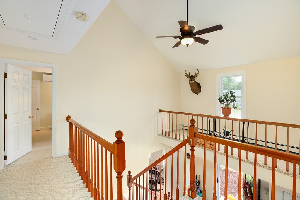 20 Chamber Rock Road Bourne, MA 02532 - Photo 12 of 30 a view of staircase with railing and a chandelier fan