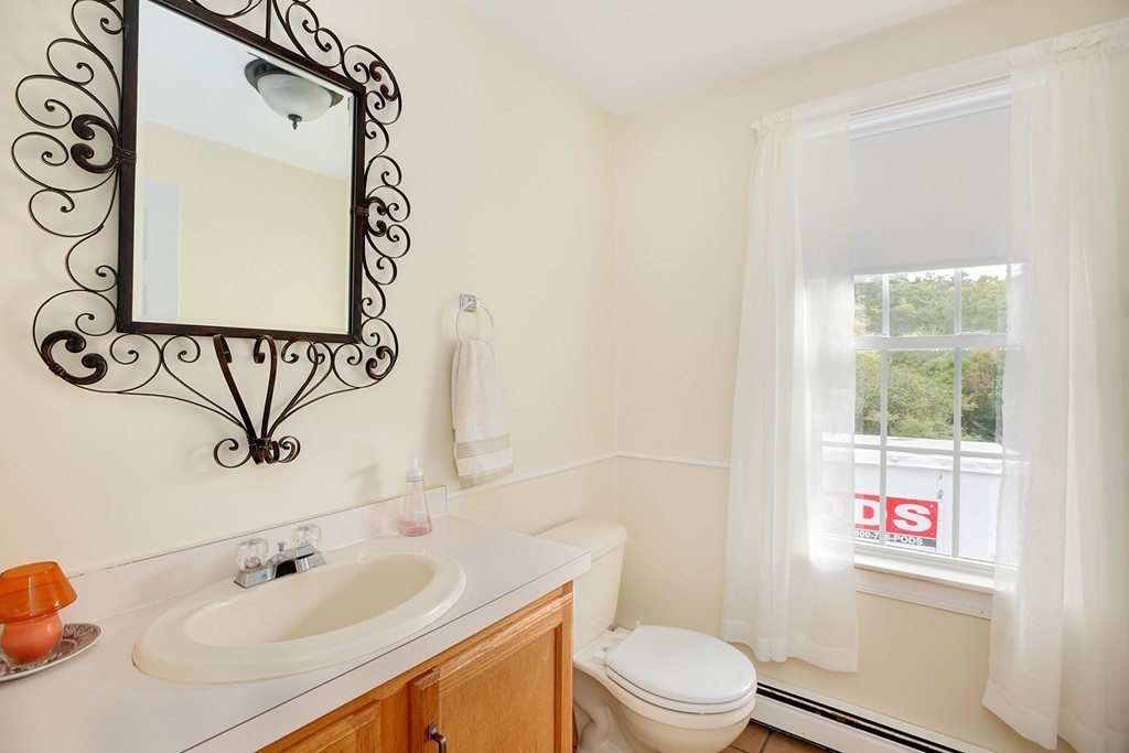20 Chamber Rock Road Bourne, MA 02532 - Photo 22 of 30 a bathroom with a sink a toilet and a mirror