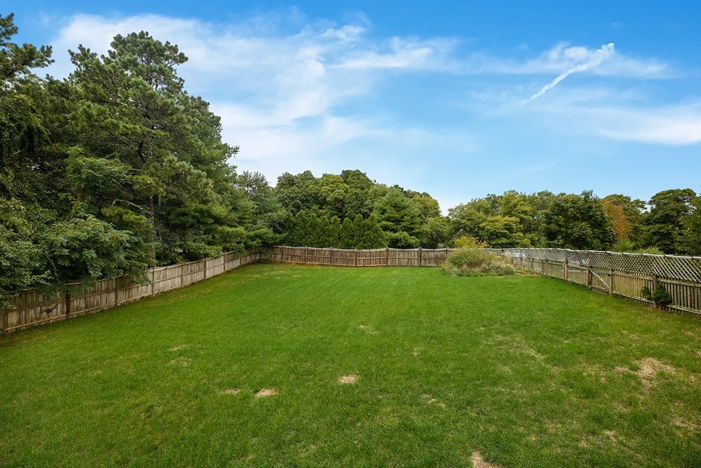 20 Chamber Rock Road Bourne, MA 02532 - Photo 28 of 30 a view of a green field with wooden fence