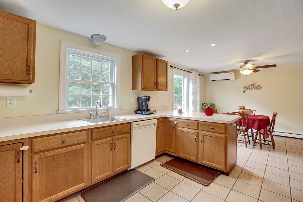 20 Chamber Rock Road Bourne, MA 02532 - Photo 7 of 30 a kitchen with a sink and cabinets