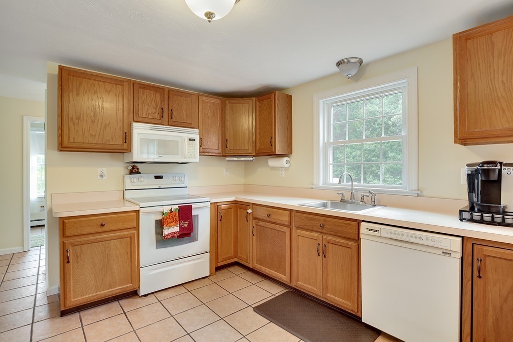 20 Chamber Rock Road Bourne, MA 02532 - Photo 8 of 30 a kitchen with a sink stove and cabinets