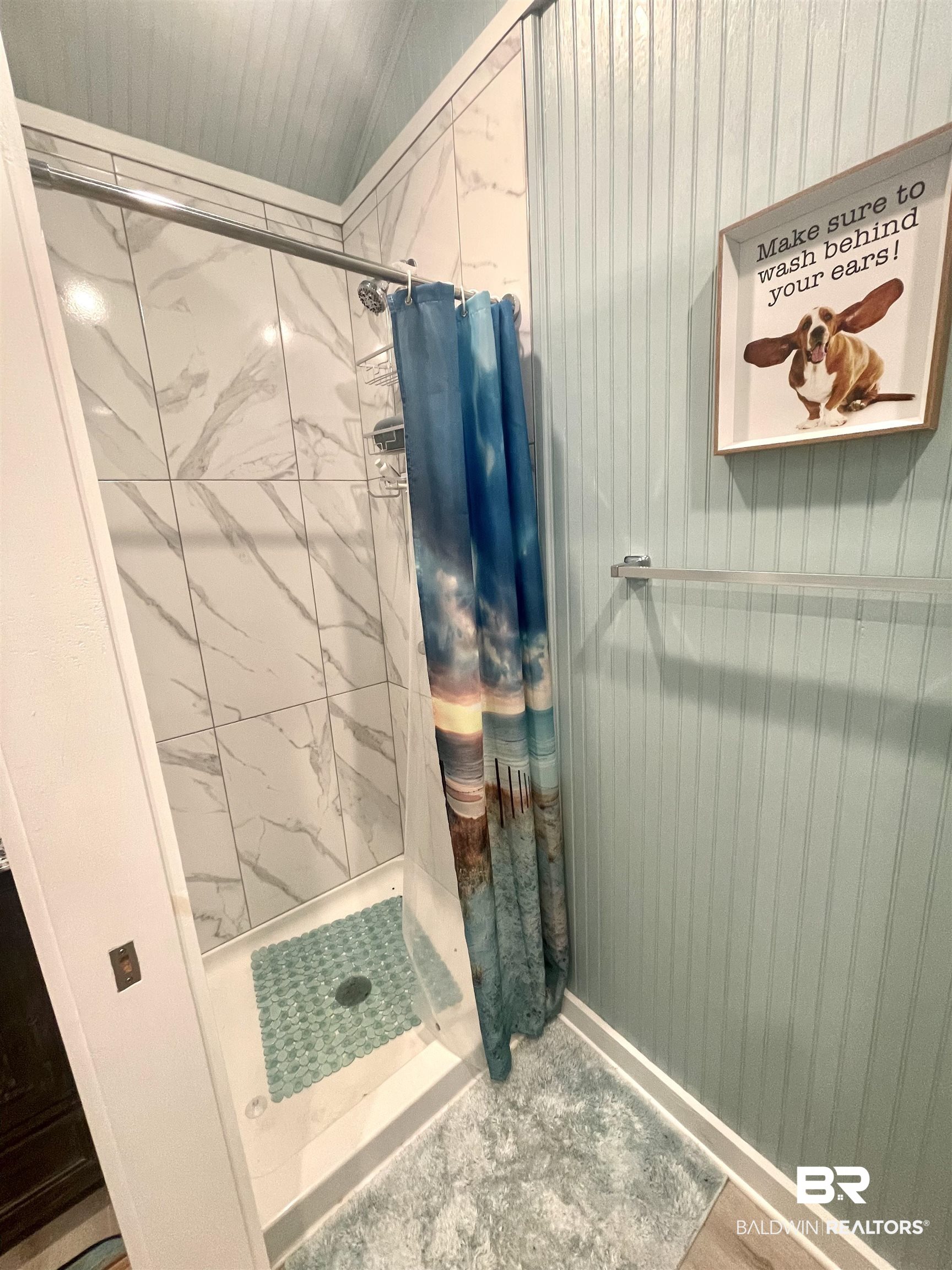 4650 Griffith Marina Road, Unit 22 Orange Beach, AL 36561 - Photo 15 of 25 Bathroom with a stall shower and vaulted ceiling