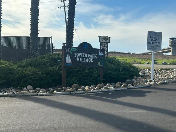 a front view of a building with street sign board