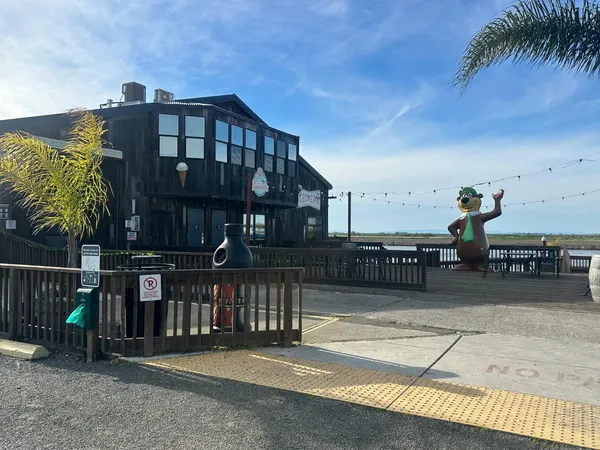 a view of a street with sitting area