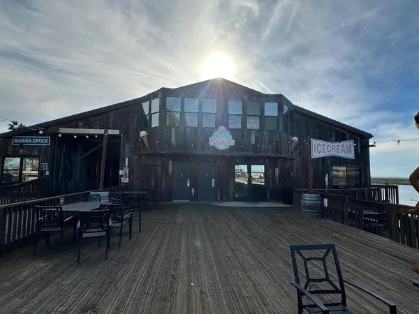 a view of a balcony with wooden floor and city view
