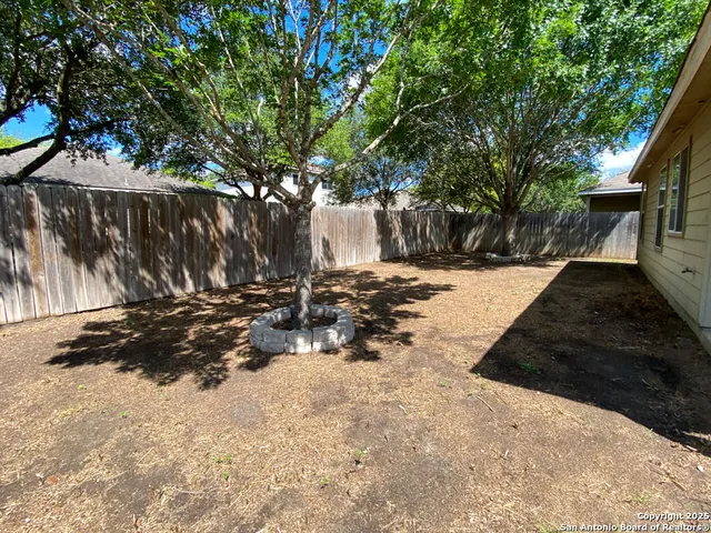 a view of a backyard of the house