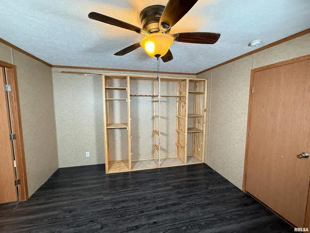 a white toilet sitting next to a sink