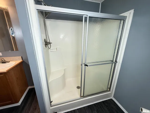 a view of dirt yard with large trees