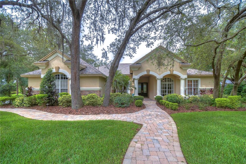 17846 Mission Oak Drive Lithia, FL 33547 - Photo 1 of 1 a front view of a house with a garden and yard