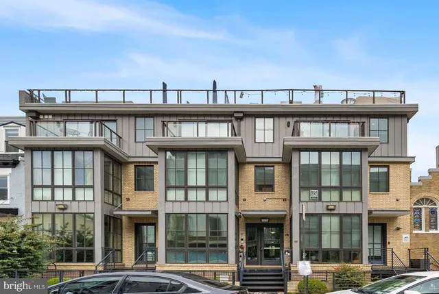 a view of a large building from a balcony