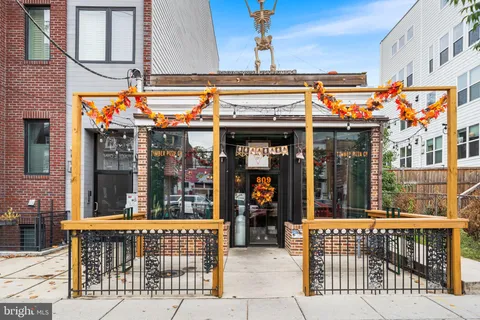 a view of a cafe with sitting area and furniture