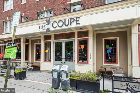 a view of a patio with table and chairs and potted plants