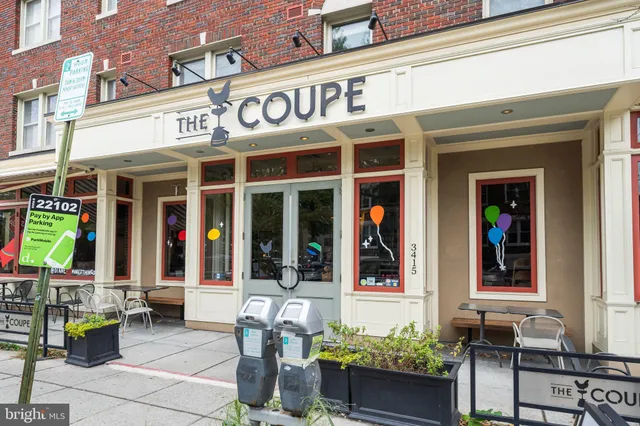 a view of a patio with table and chairs and potted plants