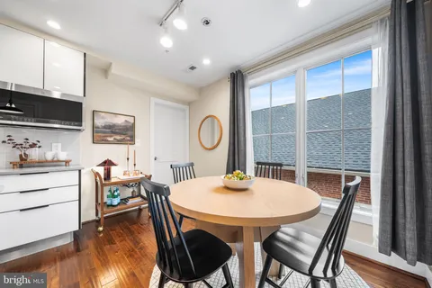 a view of a dining room with furniture and a window