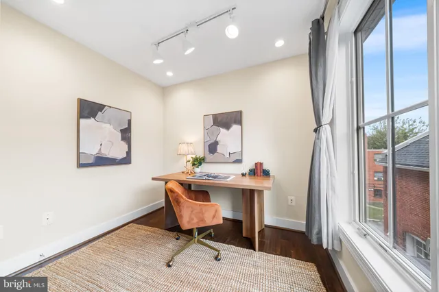 a workspace with furniture and a gate