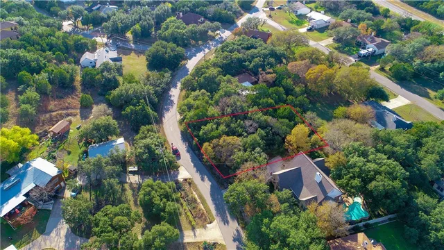 a backyard of a house with lots of trees
