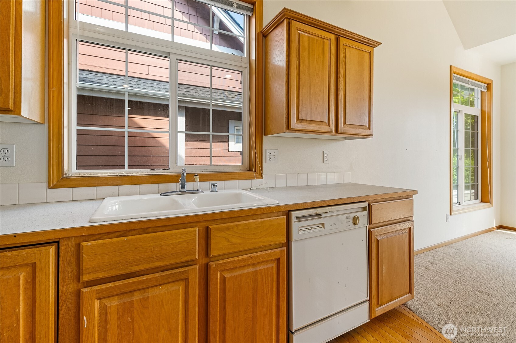 114 Twin Sisters Loop Lynden, WA 98264 - Photo 11 of 24 a kitchen with granite countertop cabinets and window