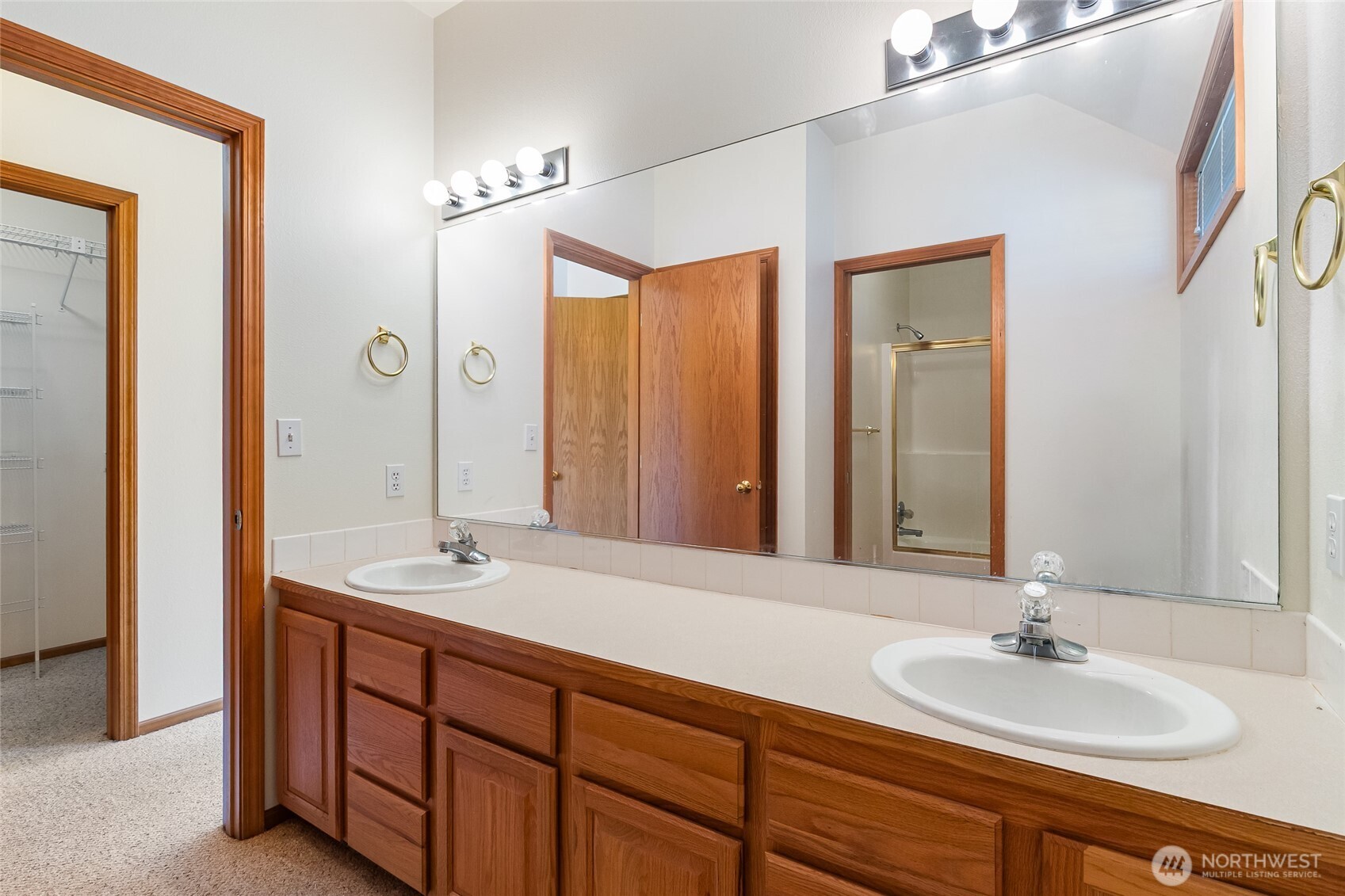 114 Twin Sisters Loop Lynden, WA 98264 - Photo 18 of 24 a bathroom with a double vanity sink and a mirror