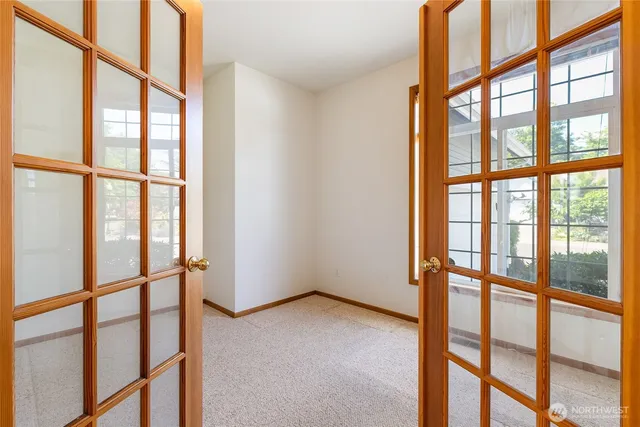 a view of an empty room with a window