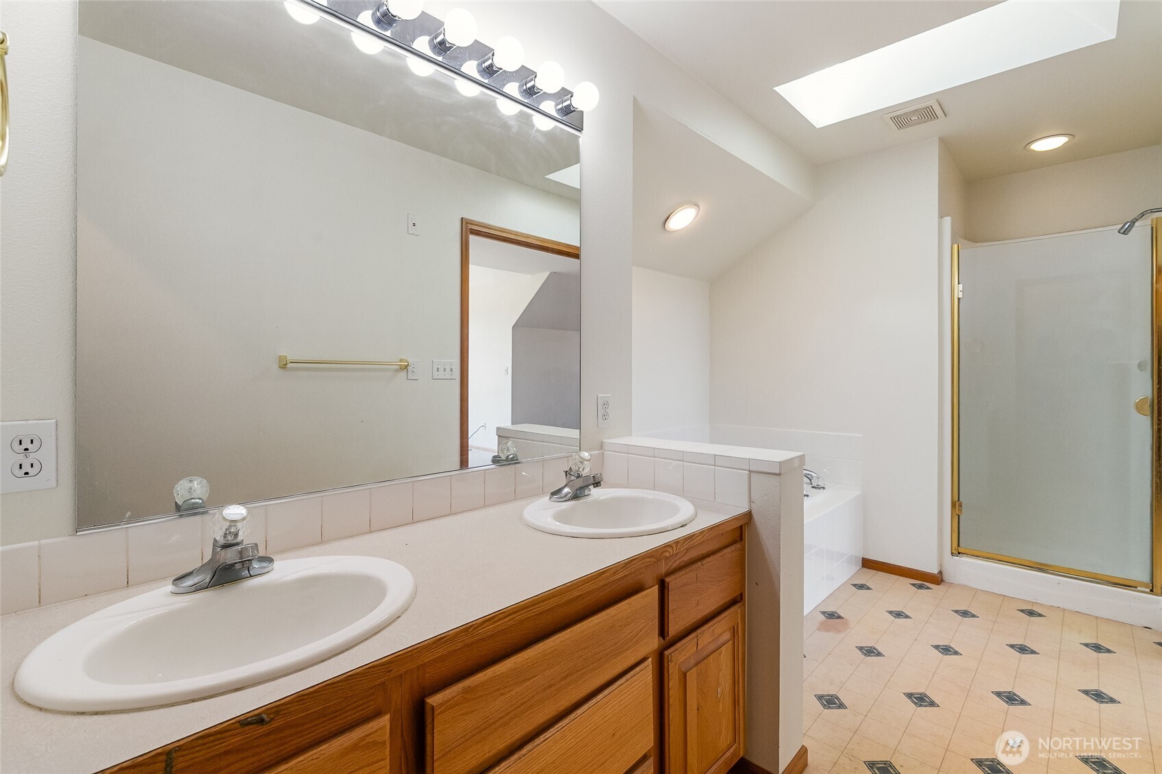 114 Twin Sisters Loop Lynden, WA 98264 - Photo 22 of 24 a bathroom with a sink and a mirror