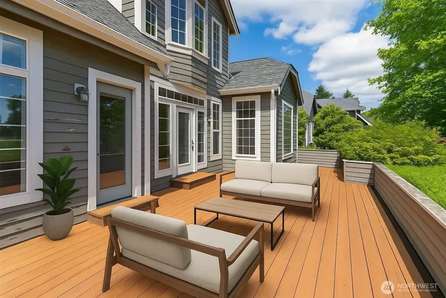 a view of a patio with couches and pool