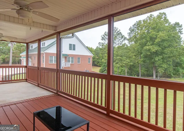 a view of a balcony with wooden floor