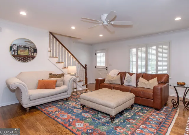 a living room with furniture and a rug