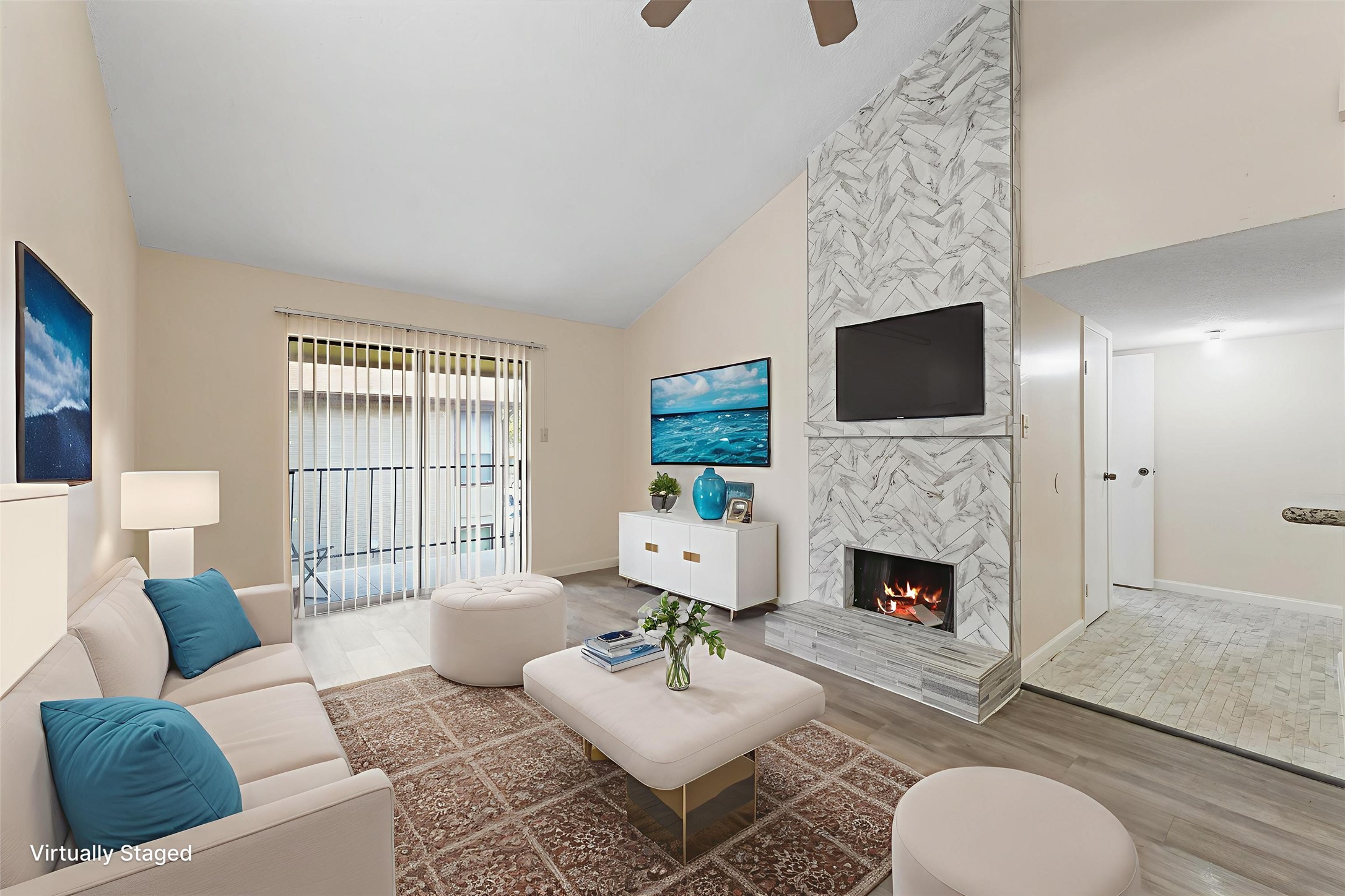 9221 Imogene Street, Unit 9221 Houston, TX 77036 - Photo 10 of 19 a living room with furniture a fireplace and a flat screen tv