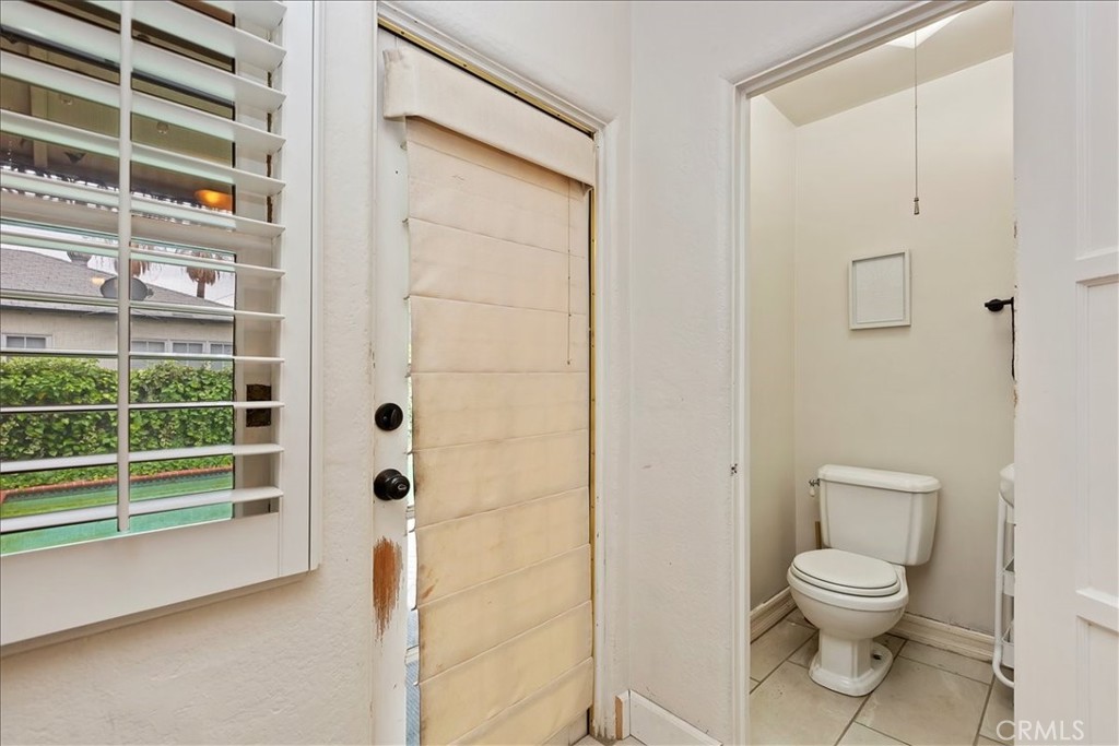 4910 Brockton Avenue Riverside, CA 92506 - Photo 18 of 35 Half-Bath / Backyard Entry
