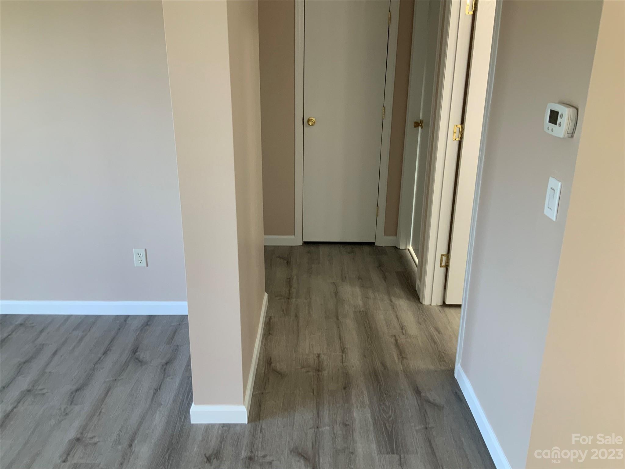 2240 Pace Road Hendersonville, NC 28792 - Photo 11 of 23 a view of a hallway with wooden floor
