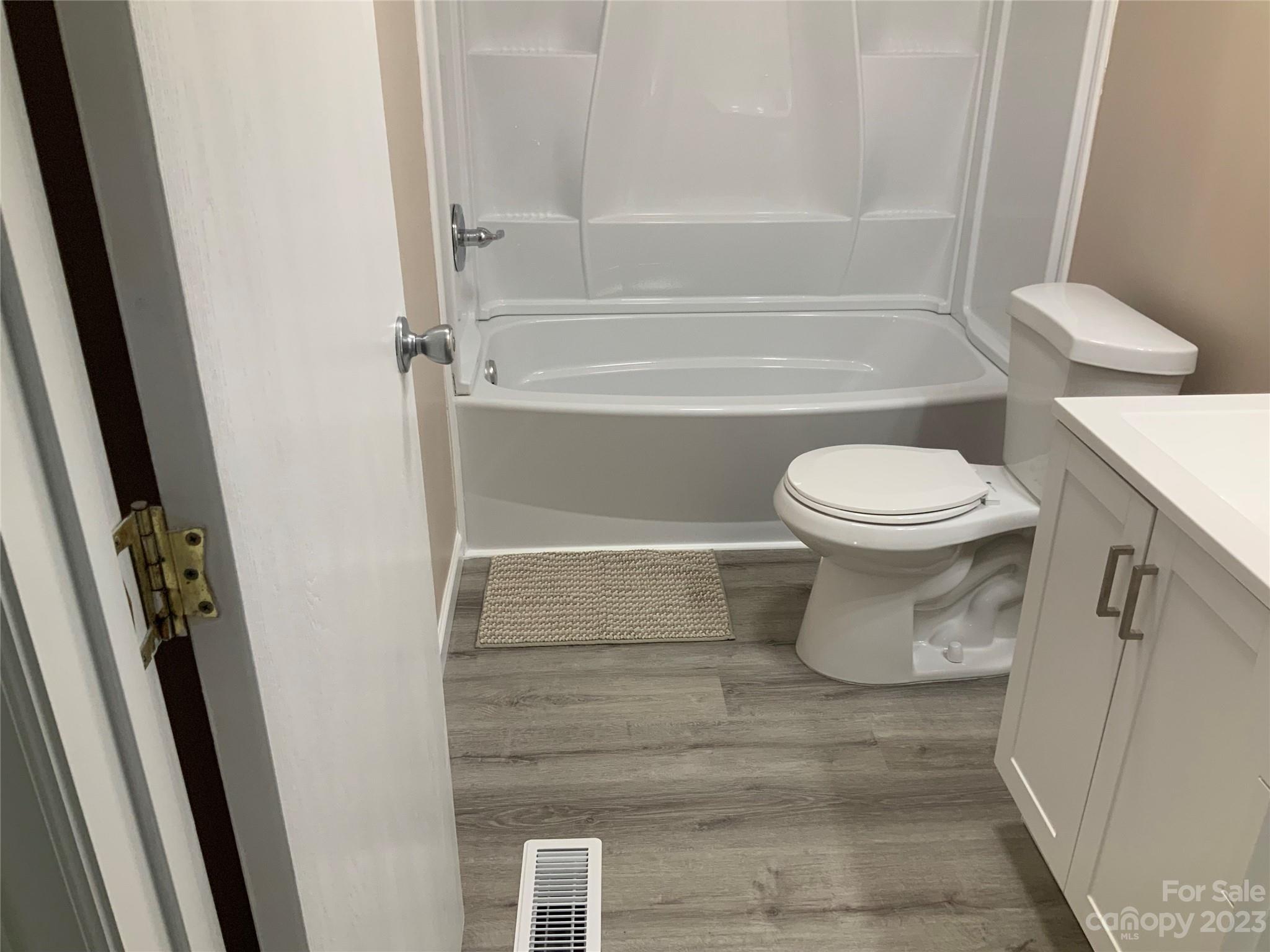 2240 Pace Road Hendersonville, NC 28792 - Photo 18 of 23 a bathroom with a toilet and a shower